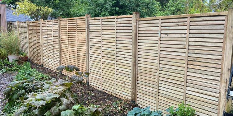 Double-sided slatted fencing, in Cowley, Oxford